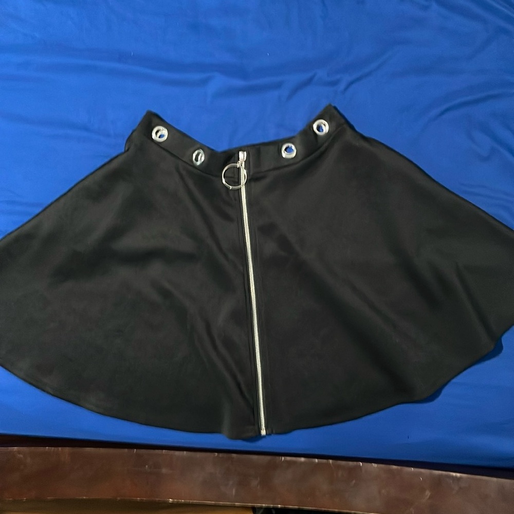 Black skirt with zipper in the middle.